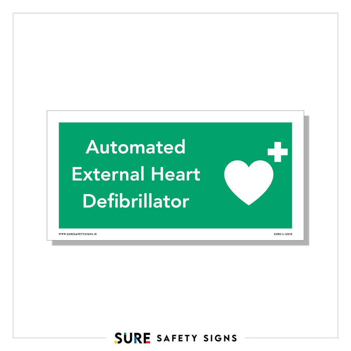 Green safety sign with white text reading Automated External Heart Defibrillator alongside a white heart symbol with a cross in the top corner. The bottom features a URL for suresafetysigns.ie, indicating its origin in Ireland.