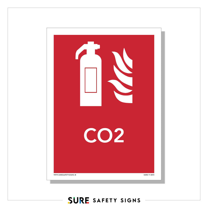 Red fire safety sign with a white silhouette of a fire extinguisher and flames above the text CO2. This crucial safety sign ensures compliance in Ireland. The company logo at the bottom reads SURE Safety Signs.