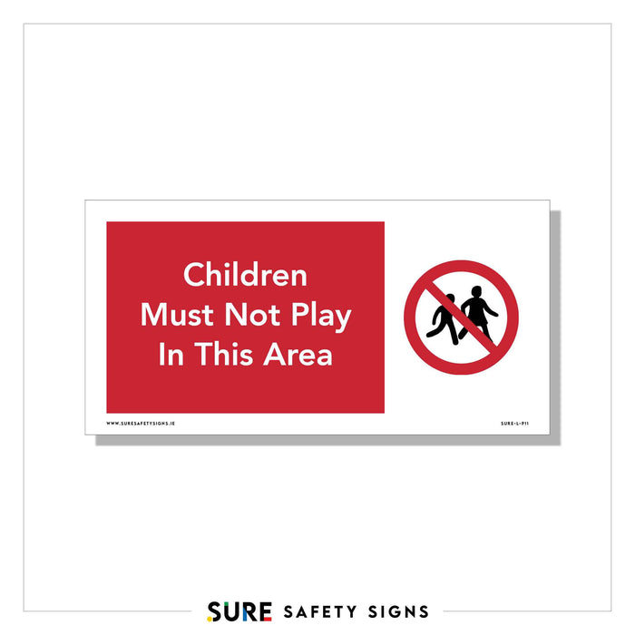 A rectangular safety sign with a red background and white text reads, Children Must Not Play In This Area. To the right, a black silhouette of two children is shown within a red prohibition circle, reminiscent of the clear and concise safety signs found throughout Ireland.