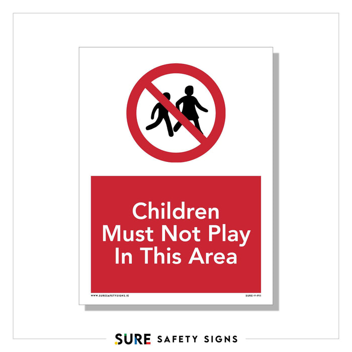 A safety sign in Ireland features a red circle with a diagonal line over two children, indicating no play. Below, red text on a white background reads: Children Must Not Play In This Area.
