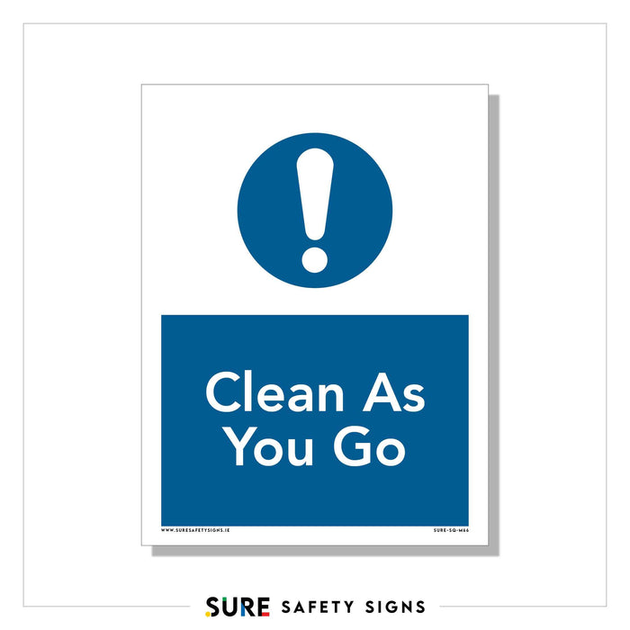 A safety sign follows Irish safety regulations, featuring a blue circle with a white exclamation mark. Below it, a blue rectangle states, Clean As You Go. This informational sign is from Sure Safety Signs and promotes workplace cleanliness.