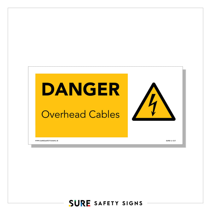 A safety sign with a yellow background and black text reads DANGER Overhead Cables, ensuring public awareness in Ireland. Accompanied by a triangular warning symbol with a lightning bolt, it emphasizes caution.