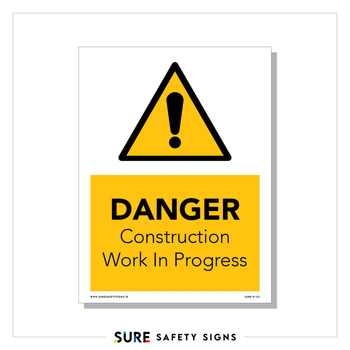 A safety sign with a yellow triangle and black exclamation mark at the top. Below, it reads DANGER Construction Work In Progress in bold black letters on a yellow background. Such signs are commonplace in Ireland, ensuring public awareness and safety around construction sites.