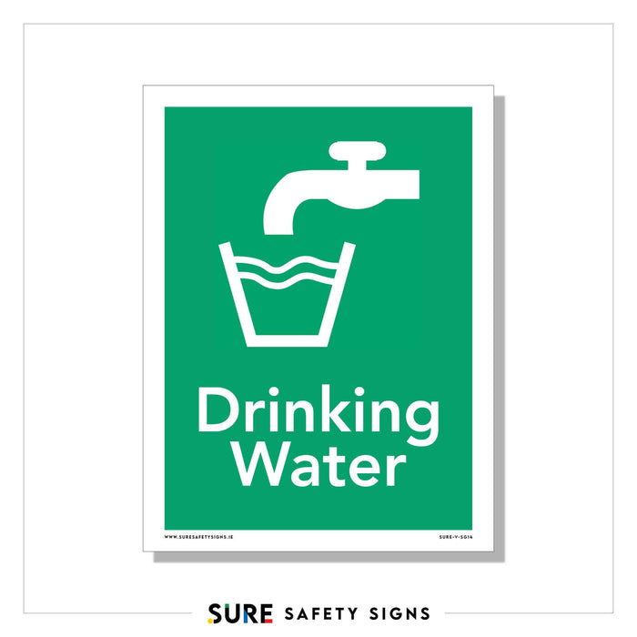 A green high-visibility sign features a white illustration of a water tap pouring water into a glass. Below the image, the text reads Safe Drinking Water.