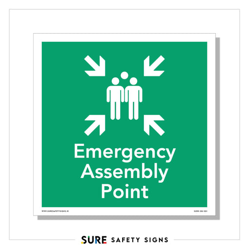 A green safety sign with white text reads Emergency Assembly Point, featuring two stylized person icons surrounded by four inward-pointing arrows. Branded SURE SAFETY SIGNS, its a common sight in Ireland, ensuring everyone knows where to gather in emergencies.