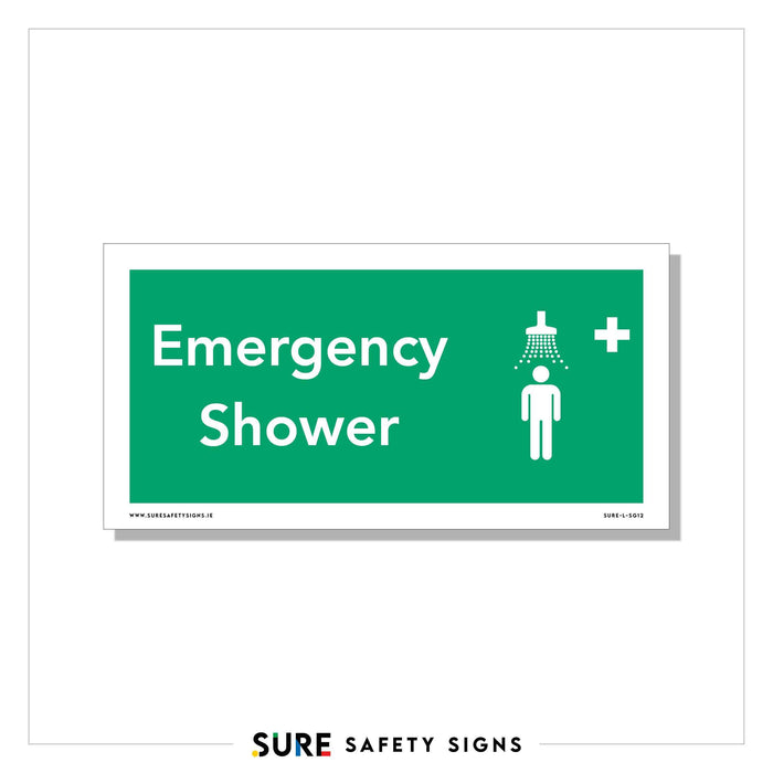 A safety sign clearly indicating Emergency Shower, featuring a symbol of a person under a shower and a white cross on a green background, ensures visible signage in critical areas.