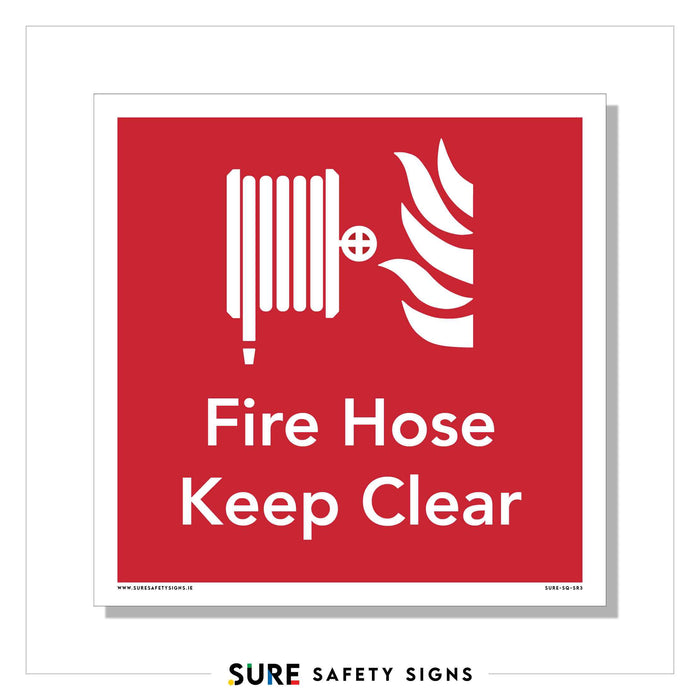 A red fire hose safety sign with white text and graphics ensures high-contrast visibility. It features an icon of a fire hose and flames, prominently displaying the words Fire Hose Keep Clear to identify essential emergency equipment.
