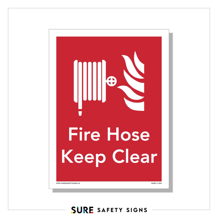 Red fire hose safety sign with a white flame icon ensures high-contrast visibility. Text reads Fire Hose Keep Clear, highlighting the importance of keeping emergency equipment accessible.