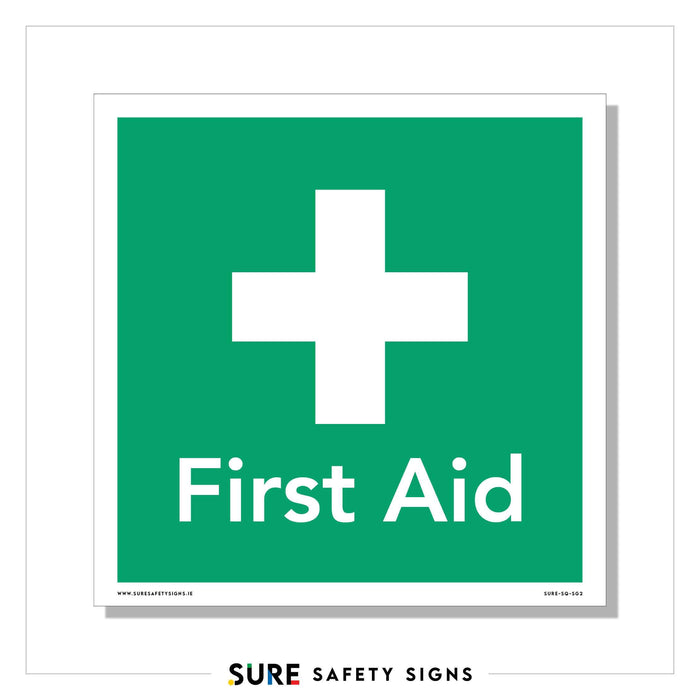 Green square sign featuring a white cross above the bold words First Aid, adhering to safety regulations. This first aid sign clearly marks the location of medical assistance or supplies.