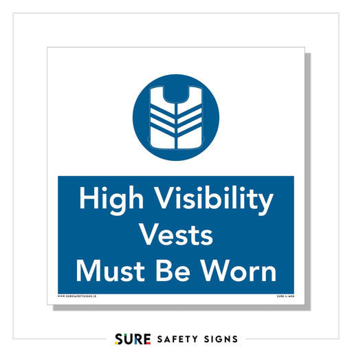 A safety sign with a blue and white design proudly displays an icon of a vest above the text High Visibility Vests Must Be Worn. This is a standard requirement in Ireland, ensuring safety on sites.