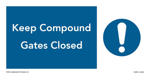 A rectangular safety sign with a blue background and a white border reads Keep Compound Gates Closed in bold white letters. To the right, an exclamation mark inside a blue circle emphasizes its importance, reminiscent of similar signs you might find in Ireland.