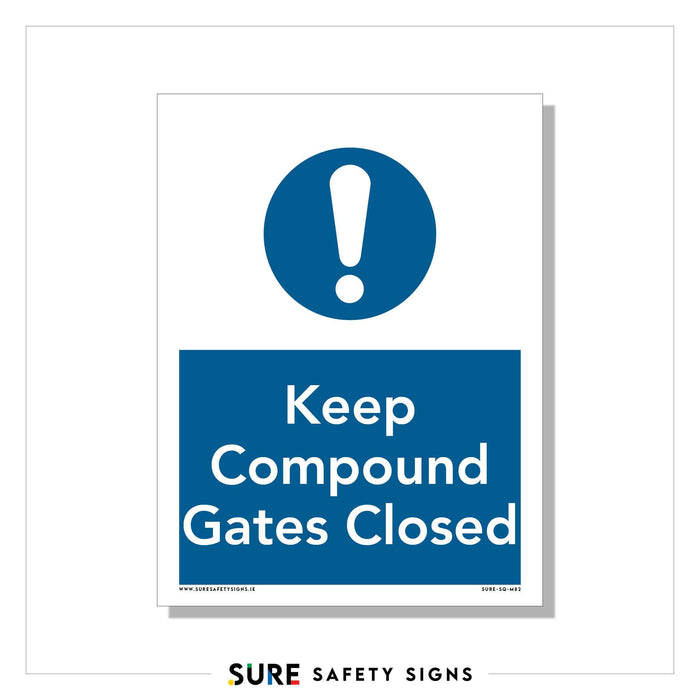 A safety sign in true Irish blue displays a bold exclamation mark within a circle. Below, the commanding white text urgently advises, Keep Compound Gates Closed.