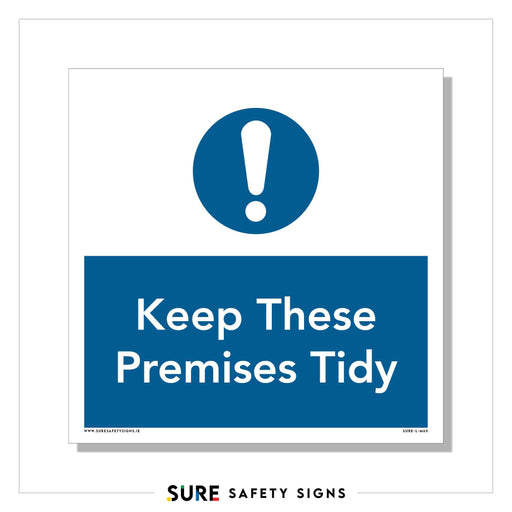 A blue and white safety sign featuring an exclamation mark symbol. The text reads Keep These Premises Tidy in white on a blue background. At the bottom, the brand logo Sure Safety Signs, Ireland is prominently displayed.