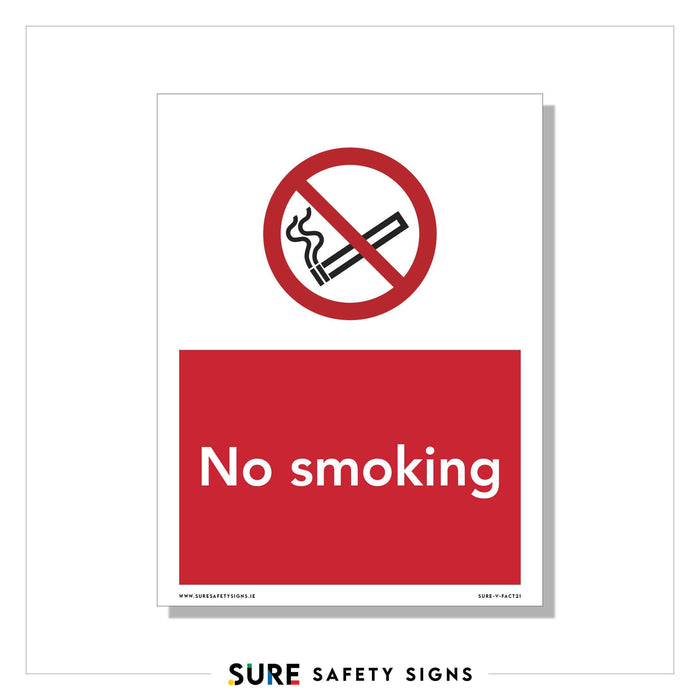 A sign with a no smoking symbol: a lit cigarette inside a red circle with a diagonal line across it. Beneath the symbol, No Smoking is written in white letters on a red background, emphasizing workplace safety regulations and smoking restrictions.