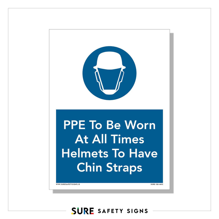 Safety sign with a white background and blue circle featuring an icon of a helmet and face shield. Text reads, PPE To Be Worn At All Times. Helmets To Have Chin Straps. Logo at the bottom says SURE SAFETY SIGNS, emphasizing workplace protection and clear safety instructions.