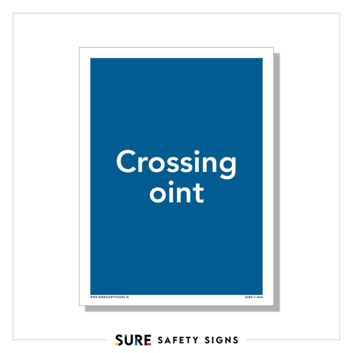 A safety sign with a blue background displays the text Crossing Point, reflecting Irelands commitment to road safety. At the bottom, it reads SURE SAFETY SIGNS in different colors.