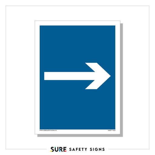 A blue rectangular directional sign with a white right-pointing arrow at its center indicates direction. Complying with top safety standards, the words SURE SAFETY SIGNS are at the bottom of the image.
