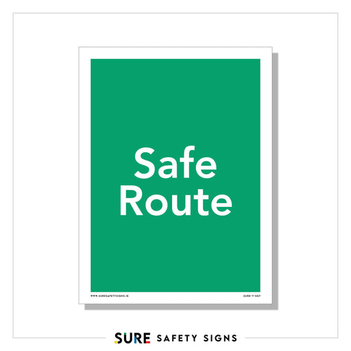 A green safety sign with white text reads Safe Route, marking one of the designated evacuation routes for a secure departure.