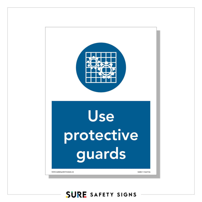 A safety sign, crafted by Sure Safety Signs, showcases a blue circle with machinery and gear symbols behind a grid pattern, instructing to Use protective guards. Below the circle, bold text reinforces: Use protective guards. Perfect for workplaces in Ireland prioritizing safety.