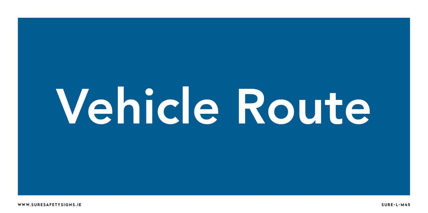 A rectangular blue safety sign with white text reading Vehicle Route adds a touch of order, much like those seen along the scenic roads of Ireland.