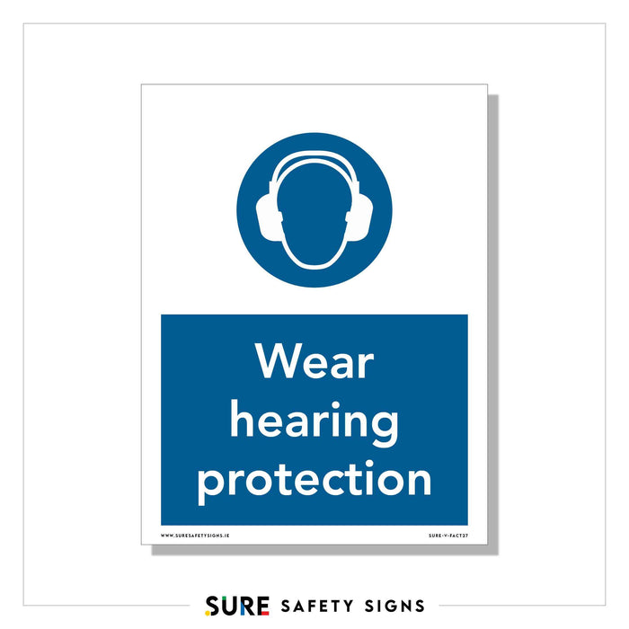 A safety sign with a blue circle featuring an ear defender symbol on a persons head. Below, the text reads Wear hearing protection, emphasizing workplace safety regulations.