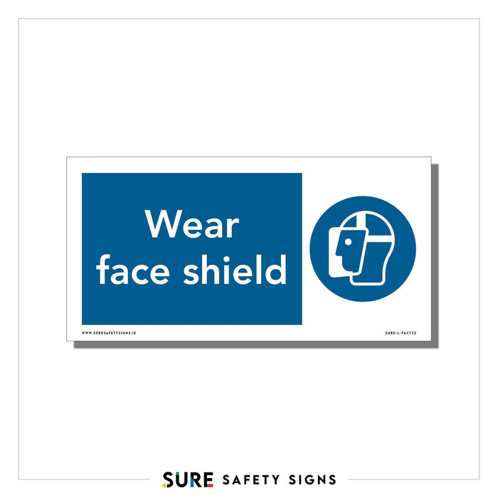 A safety sign with a blue background and white text reading Wear face shield, reminiscent of those found in workplaces across Ireland. Next to the text is an icon depicting a face wearing a face shield, underscoring the importance of protection.