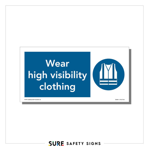 Sign with a blue background features white text: Wear high visibility clothing. To the right, an icon shows a high-visibility vest. This safety sign is commonly seen on construction sites across Ireland.