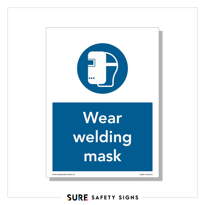 Sign with a blue circle at the top showing a white welding mask icon. Below, in a blue rectangular section, it reads Wear welding mask in white text. This sign emphasizes PPE requirements and workplace safety standards. The bottom mentions SURE SAFETY SIGNS.